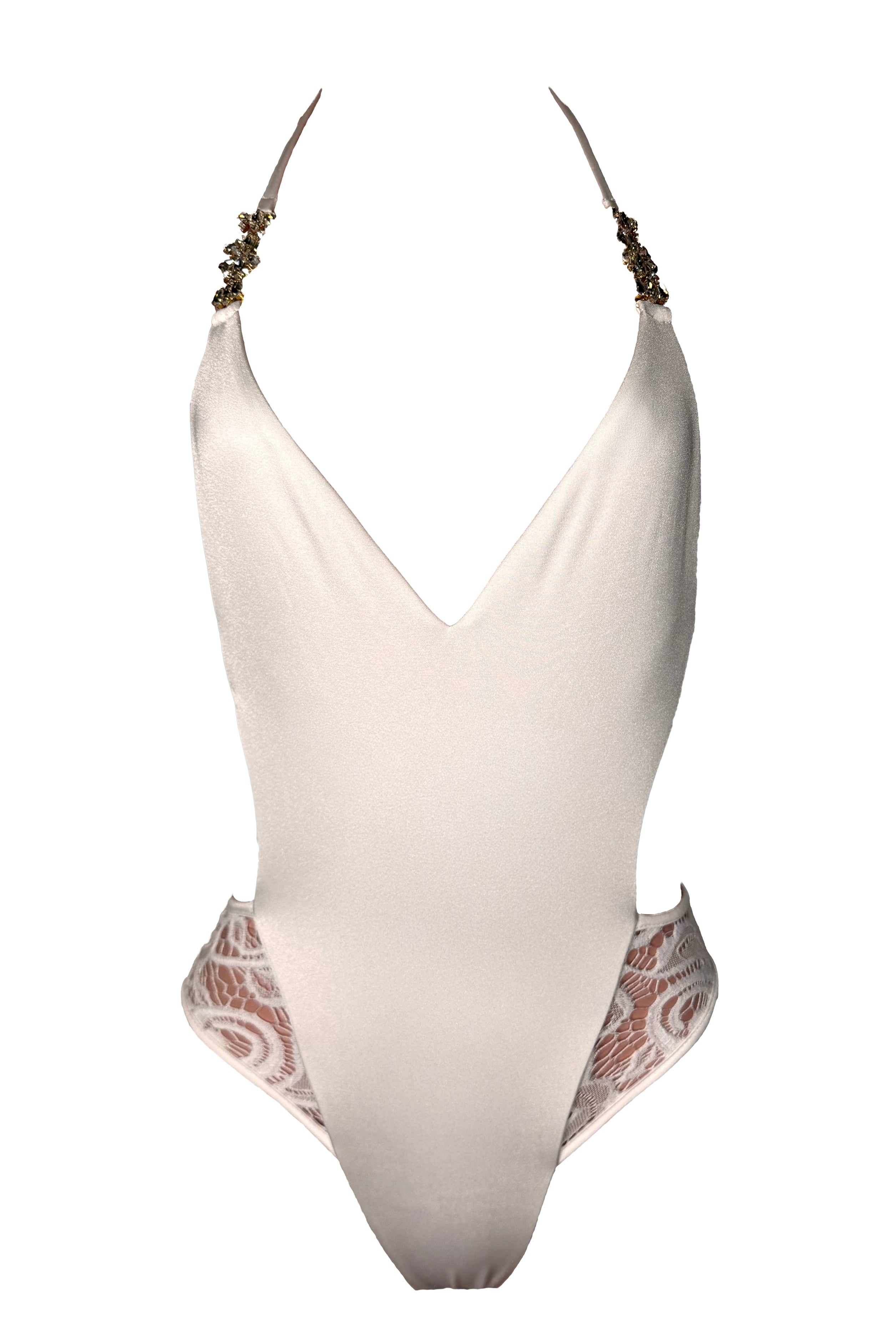 White swimsuit with lace details on a white background